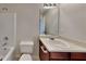 A bathroom featuring a sink, mirror, toilet, and tub with shower at 4928 Bryant Dr, Snellville, GA 30039