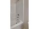 Bathtub with white tub surround and chrome fixtures at 4928 Bryant Dr, Snellville, GA 30039
