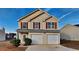 Charming two-story home with red shutters and a two-car garage at 4928 Bryant Dr, Snellville, GA 30039