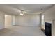 Inviting living room with a fireplace, ceiling fan, and cozy carpeting at 4928 Bryant Dr, Snellville, GA 30039