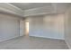 Large main bedroom with tray ceiling and neutral color palette at 4928 Bryant Dr, Snellville, GA 30039
