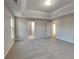 Spacious main bedroom featuring a tray ceiling and neutral carpeting at 4928 Bryant Dr, Snellville, GA 30039