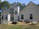Backyard featuring a fire pit area with seating at 561 Old Loganville Rd, Loganville, GA 30052