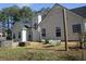 Backyard featuring a fire pit area with seating and string lights at 561 Old Loganville Rd, Loganville, GA 30052