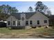 Backyard with large trees and fire pit at 561 Old Loganville Rd, Loganville, GA 30052