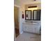 Bright bathroom featuring a double vanity and granite countertops at 561 Old Loganville Rd, Loganville, GA 30052