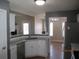 Well-lit kitchen features modern cabinets, stainless steel appliances, and a convenient layout at 561 Old Loganville Rd, Loganville, GA 30052