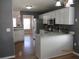 Modern kitchen with white cabinetry, stainless steel appliances, and light countertops at 561 Old Loganville Rd, Loganville, GA 30052
