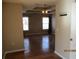 Spacious living room with hardwood floors and coffered ceiling with ceiling fan at 561 Old Loganville Rd, Loganville, GA 30052