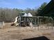 Community playground featuring a variety of slides, swings, and climbing structures for children to enjoy at 561 Old Loganville Rd, Loganville, GA 30052