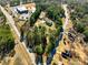 An aerial view of a wooded neighborhood featuring mature trees and a mobile home at 1515 Ozora Rd, Loganville, GA 30052