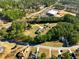 An aerial view of the wooded neighborhood featuring mature trees and a mobile home at 1515 Ozora Rd, Loganville, GA 30052