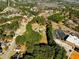 A high aerial view shows a mobile home lot with mature trees at 1515 Ozora Rd, Loganville, GA 30052