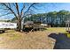 Wooden deck is attached to this mobile home surrounded by trees at 1515 Ozora Rd, Loganville, GA 30052