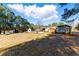 A view of the backyard featuring sheds and a mobile home at 1515 Ozora Rd, Loganville, GA 30052