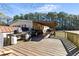 Expansive wooden deck perfect for outdoor entertaining, complete with multiple grilling stations at 1515 Ozora Rd, Loganville, GA 30052