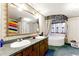 Bathroom features double sinks, large mirror, and soaking tub, providing a luxurious experience at 1515 Ozora Rd, Loganville, GA 30052