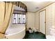 Well-maintained bathroom featuring a large soaking tub and decorative accents, creating a relaxing atmosphere at 1515 Ozora Rd, Loganville, GA 30052
