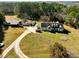Charming home with well-maintained lawn and multiple vehicles, offering ample space and curb appeal at 1515 Ozora Rd, Loganville, GA 30052