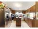 Spacious kitchen boasting ample cabinet space, stainless steel refrigerator, and functional center island at 1515 Ozora Rd, Loganville, GA 30052