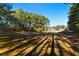 Expansive view of the land, highlighted by mature trees, showcasing the property's natural beauty at 1515 Ozora Rd, Loganville, GA 30052