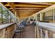 Inviting covered porch with comfortable seating, perfect for relaxing and enjoying the outdoor views at 1515 Ozora Rd, Loganville, GA 30052