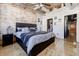 Comfortable bedroom featuring modern furniture and a view into a large closet at 244 Peters St # 23, Atlanta, GA 30313