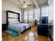 Comfortable bedroom featuring a bed, a computer desk, and multiple windows with natural light at 244 Peters St # 23, Atlanta, GA 30313