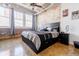Bedroom with exposed brick wall, large window, and modern decor at 244 Peters St # 23, Atlanta, GA 30313