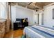 Well-lit bedroom featuring a desk with multiple monitors and a comfortable-looking queen bed at 244 Peters St # 23, Atlanta, GA 30313