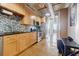Bright kitchen with wooden cabinets, stainless steel appliances, and views to the living area at 244 Peters St # 23, Atlanta, GA 30313