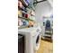 Functional laundry room with washer, dryer, and ample shelving for storage at 244 Peters St # 23, Atlanta, GA 30313