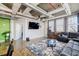 Bright living room featuring high ceilings, polished concrete floors, and a comfortable gray sofa at 244 Peters St # 23, Atlanta, GA 30313
