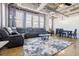 Open-concept living room featuring modern furnishings and a view of the city at 244 Peters St # 23, Atlanta, GA 30313