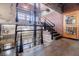 Brick interior staircase with metal railing and exposed beams at 244 Peters St # 23, Atlanta, GA 30313