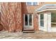 A spacious wooden back deck with double doors and bay window provide a relaxing outdoor space at 2976 Wilsons Crossing Ct, Decatur, GA 30033