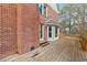 A brick home with a wooden deck and bay window offer a comfortable space at 2976 Wilsons Crossing Ct, Decatur, GA 30033