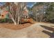 A brick home has a wooden deck with steps down to the backyard at 2976 Wilsons Crossing Ct, Decatur, GA 30033