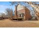 A spacious backyard with a wooden deck compliments this beautiful brick and siding home at 2976 Wilsons Crossing Ct, Decatur, GA 30033