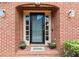 Elegant front door with glass panels, sidelights, and a decorative 'HOME' welcome mat at 2976 Wilsons Crossing Ct, Decatur, GA 30033