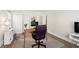 Cozy home office with hardwood flooring, a neutral rug, bright window, and a simple work desk at 2976 Wilsons Crossing Ct, Decatur, GA 30033