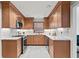 Well-lit kitchen showcases custom cabinets, stainless steel appliances, granite counters and tiled backsplash, blending style and functionality at 2976 Wilsons Crossing Ct, Decatur, GA 30033