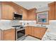 Updated kitchen with wood cabinets, stainless steel appliances, granite counters, and subway tile, a chef's delight at 2976 Wilsons Crossing Ct, Decatur, GA 30033