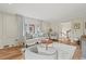Well-decorated living room with hardwood floors, fireplace, built-ins and ample seating at 2976 Wilsons Crossing Ct, Decatur, GA 30033
