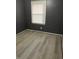 Cozy bedroom features neutral paint, wood-look floors, and a window for natural light at 650 Robert E Lee Pkwy, Jonesboro, GA 30238