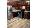 Traditional kitchen with stained wood cabinets, stainless steel fridge, and modern appliances at 650 Robert E Lee Pkwy, Jonesboro, GA 30238