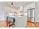 Modern kitchen with stainless steel appliances, island seating, and white cabinetry at 1100 Arkwright Se Pl # B, Atlanta, GA 30316