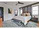 Bedroom features a king bed, gray rug, natural light, and modern decor at 1100 Arkwright Se Pl # B, Atlanta, GA 30316