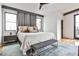 Spacious bedroom with hardwood floors, large windows, and a comfortable king-size bed at 1100 Arkwright Se Pl # B, Atlanta, GA 30316