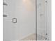 Modern shower features white subway tiles, glass doors, and a built-in bench at 1100 Arkwright Se Pl # B, Atlanta, GA 30316